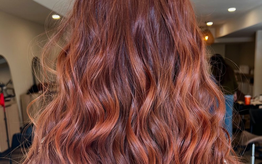 Lived-in copper hair color with soft dimension through the lengths, colored by Kayla MacArthur.