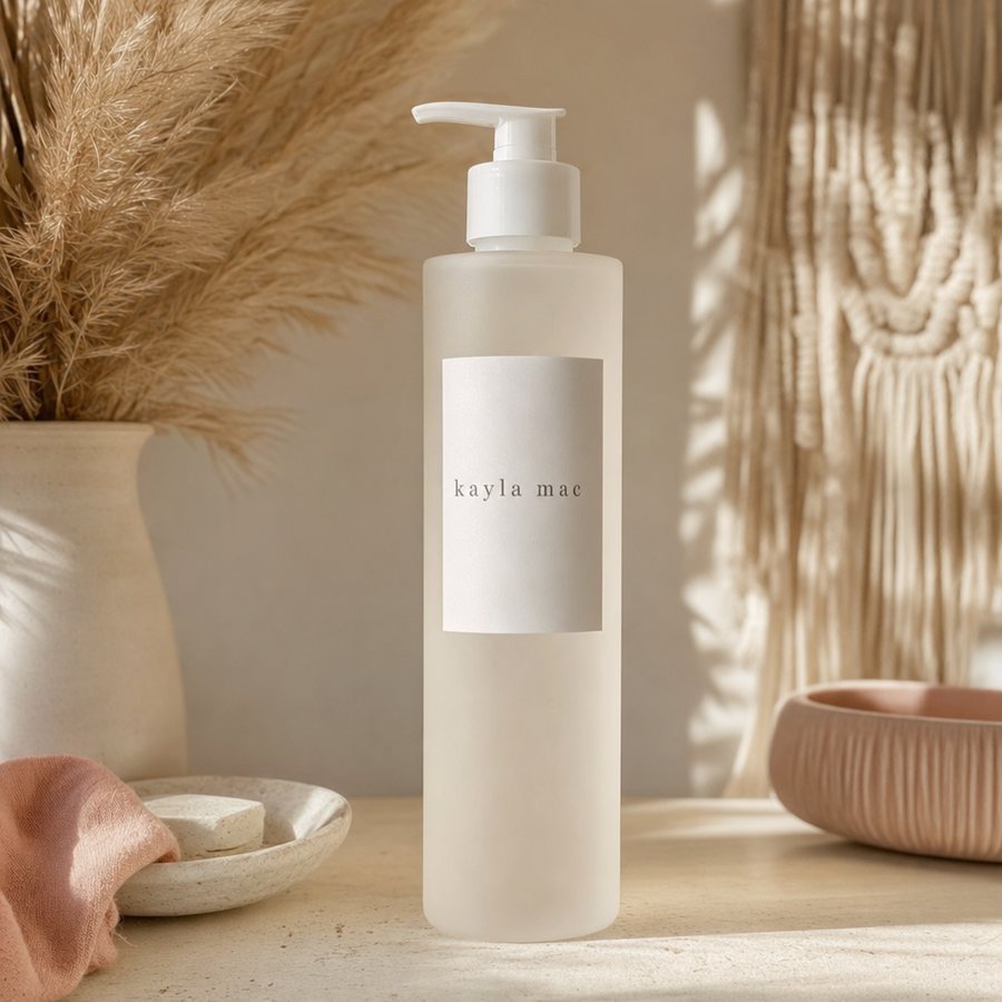 Kayla Mac Color-Guard Shampoo bottle on a cream boho backdrop.